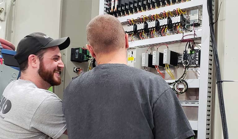 Technicians working on a chamber