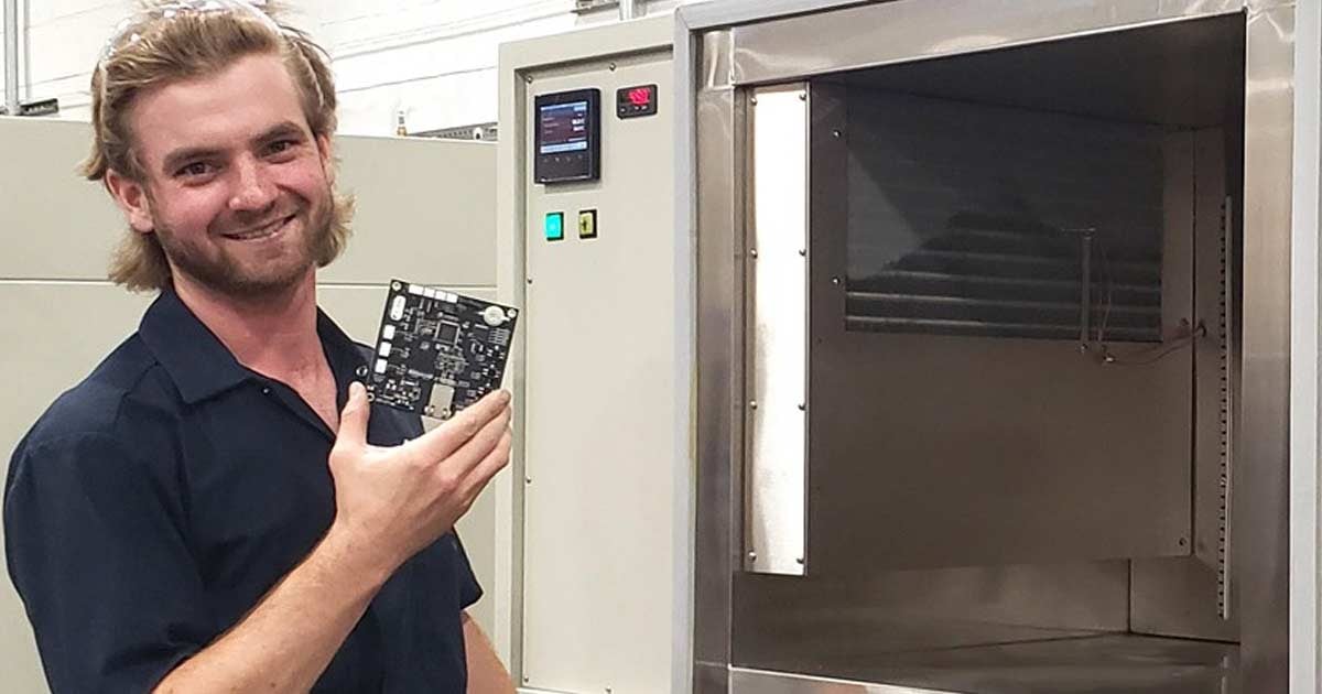 Technician next to chamber