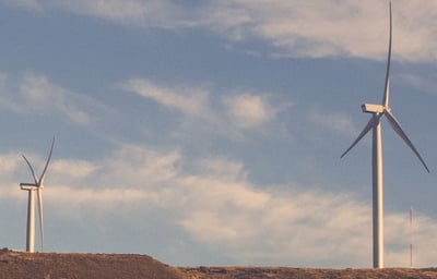 2 windmills by associated environmental systems
