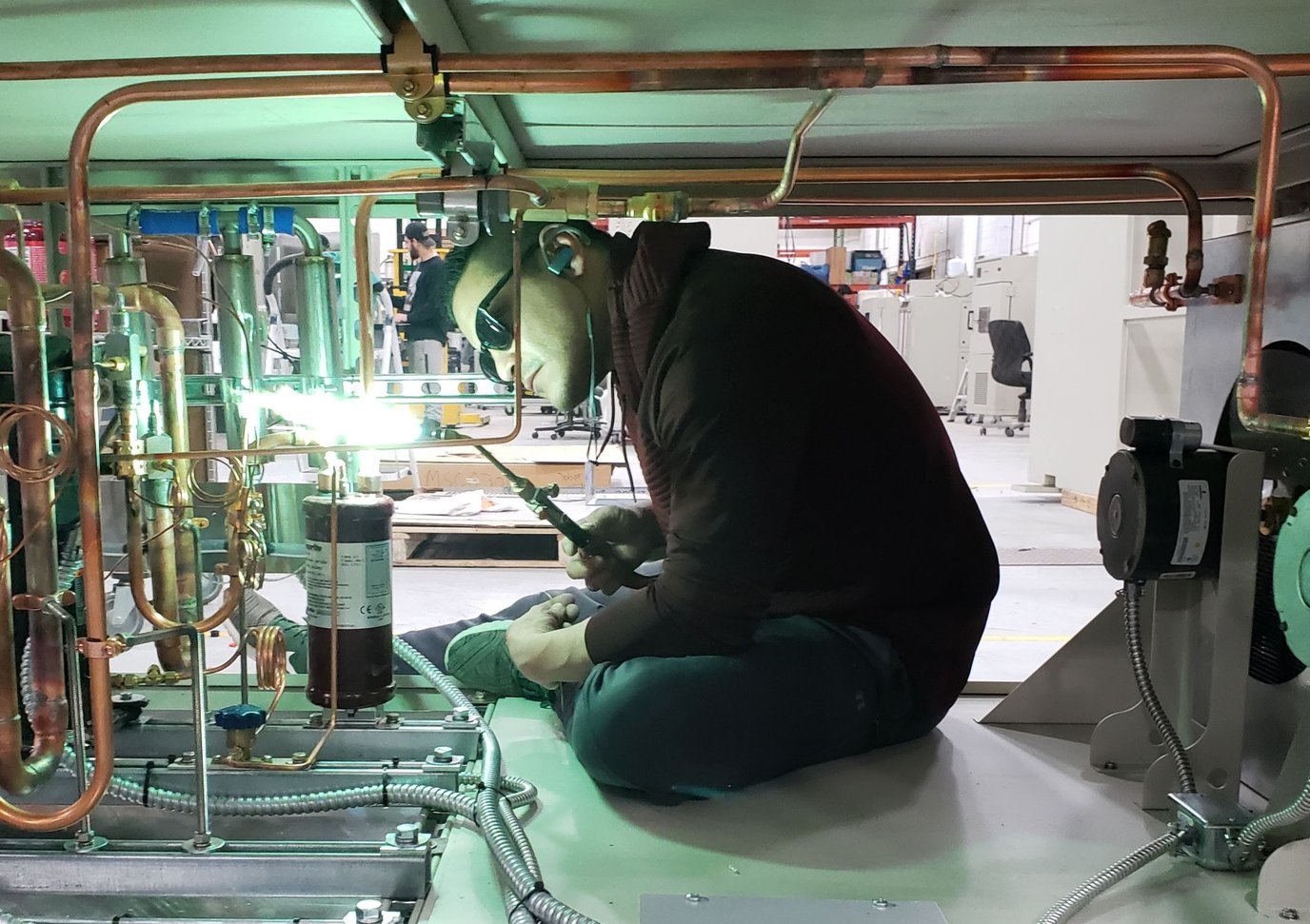 What is the standard refrigeration system used in an AES environmental