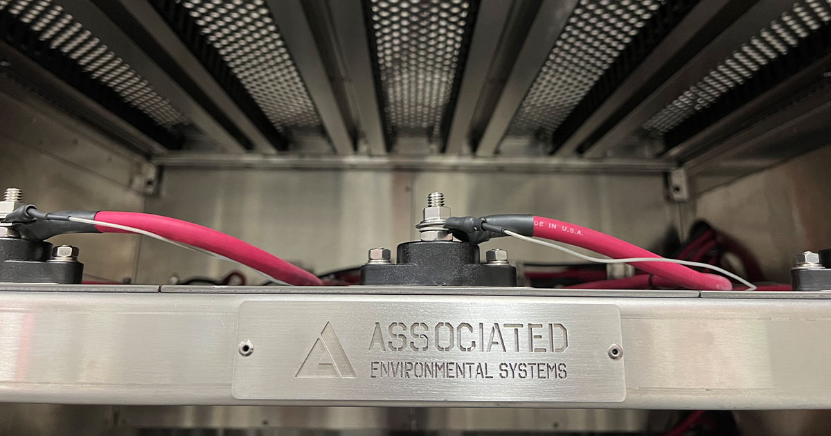 A closeup of the AES logo on a custom test chamber.