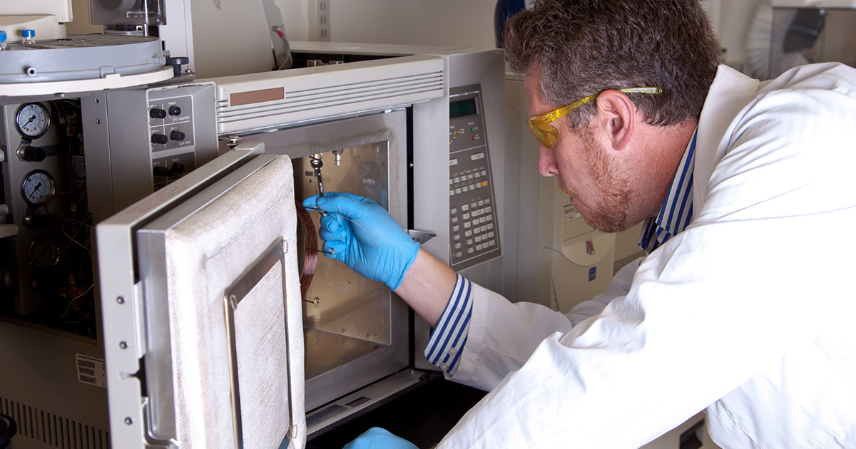 Scientist prepares laboratory oven