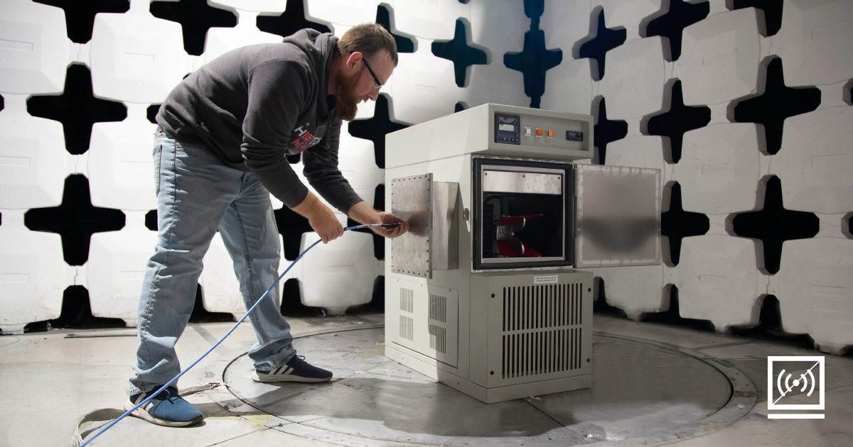 An AES employee configuring a test chamber. 